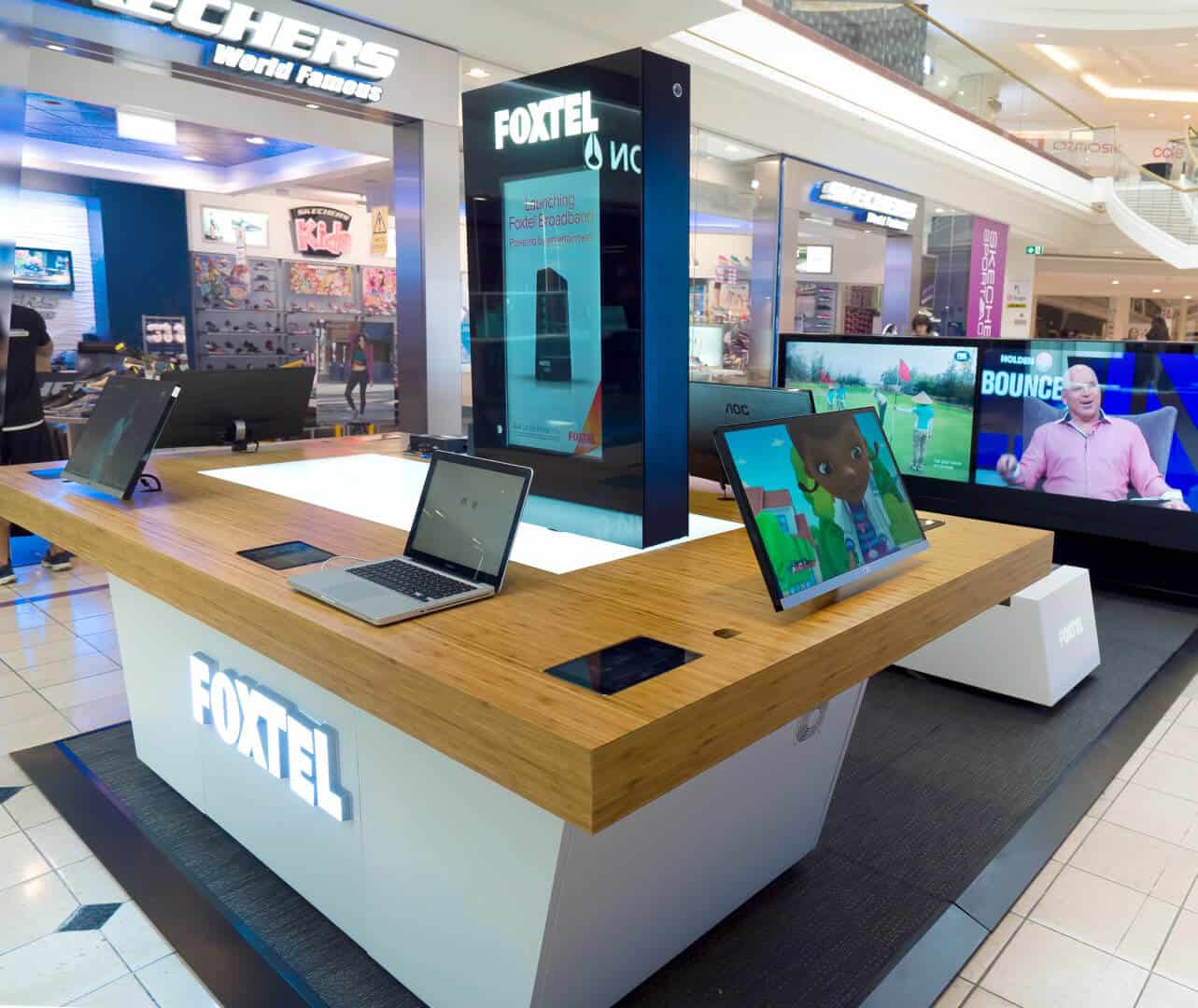 Laptops on Foxtel kiosk table top