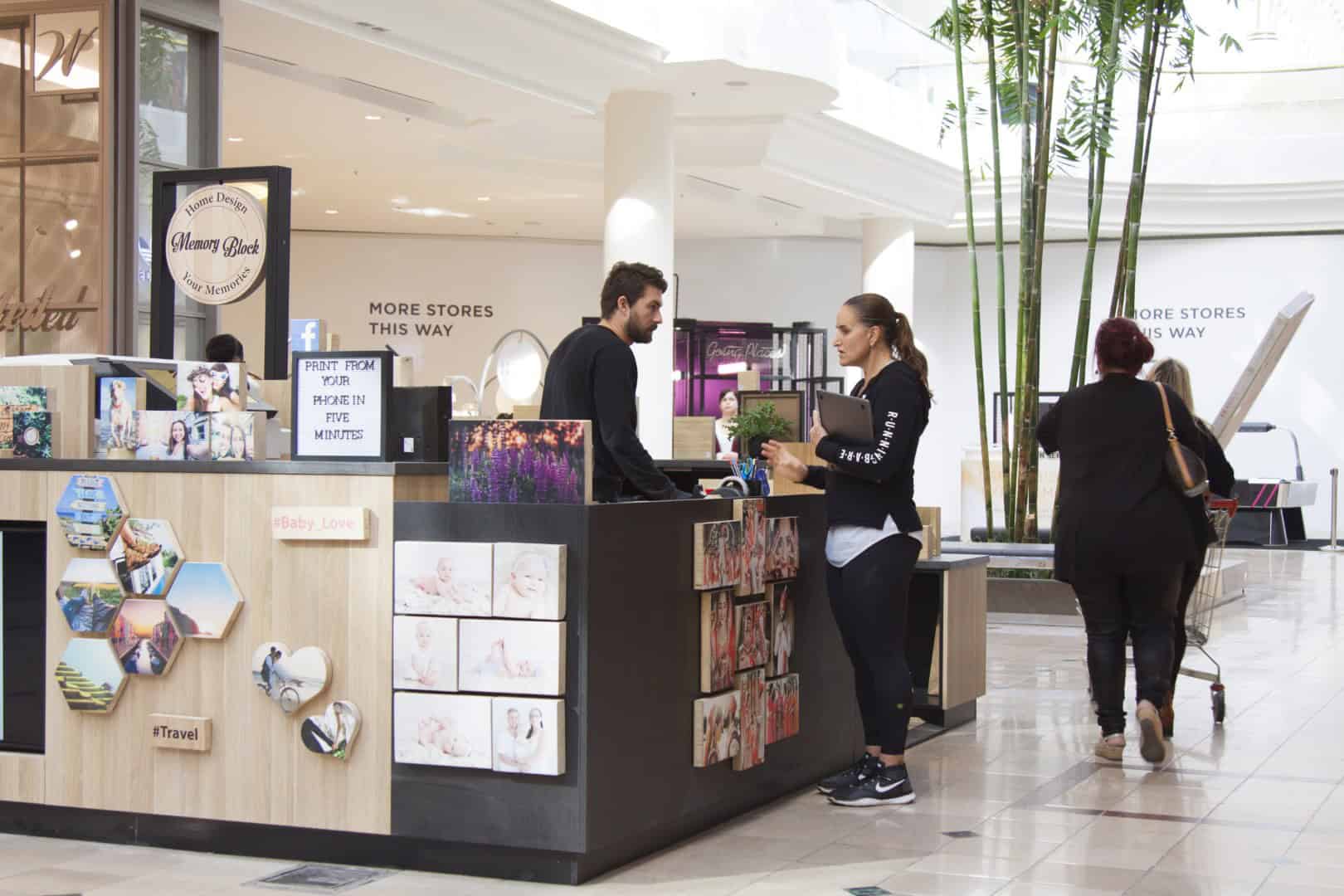 woman talking to staff at memory block studio