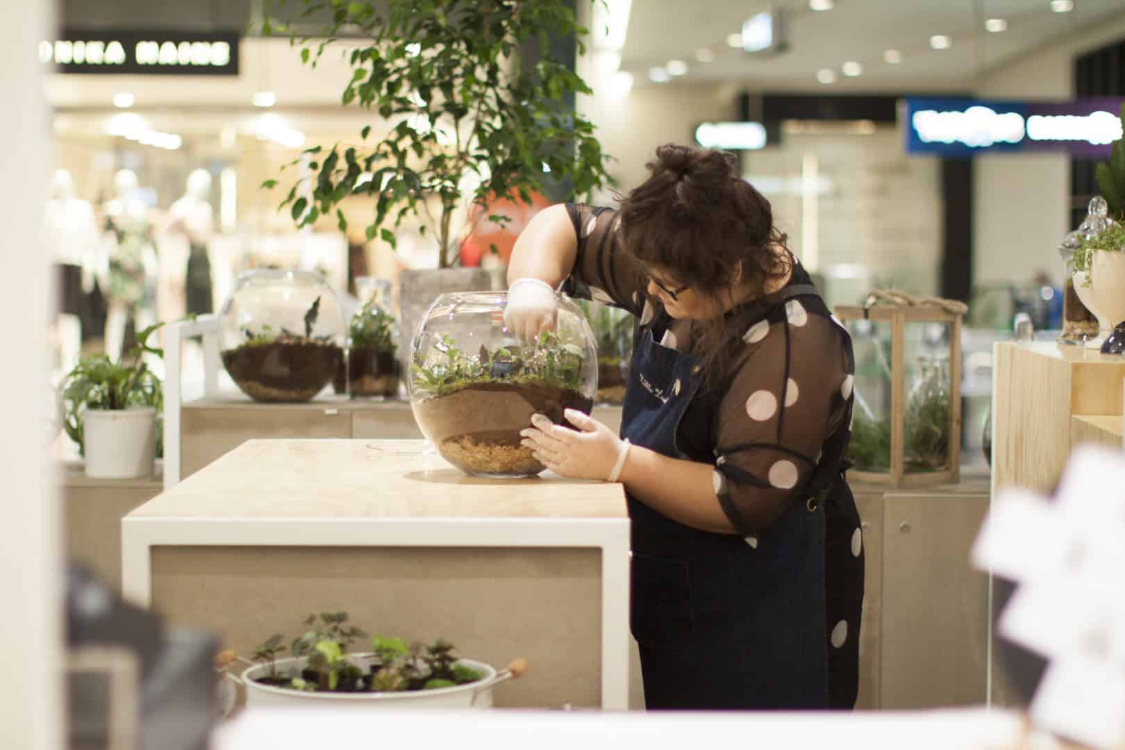 Woman fixing a plant